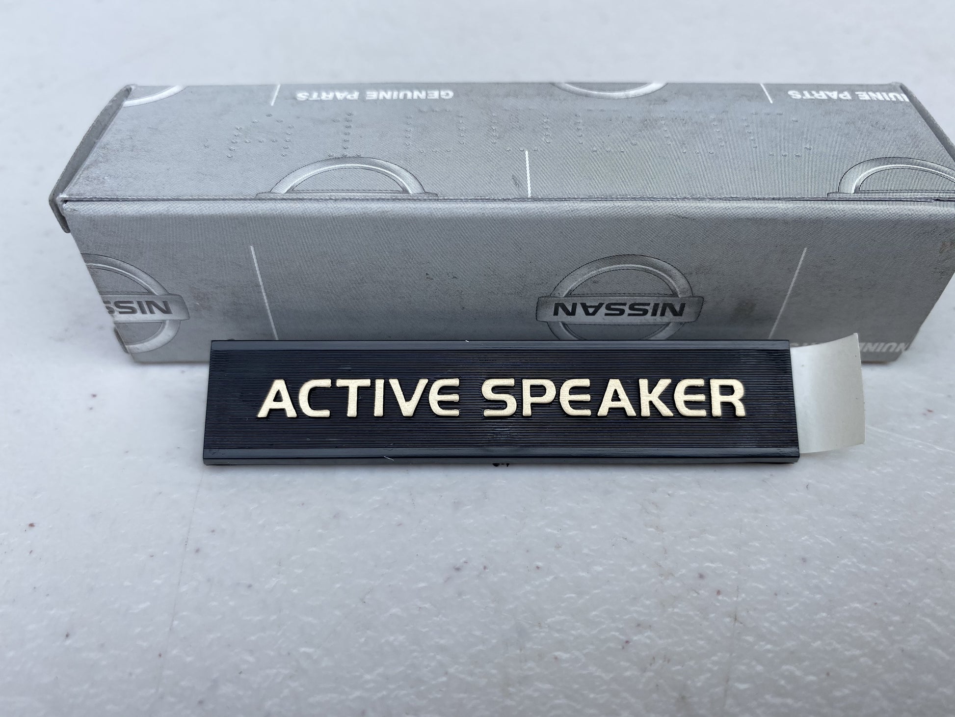 Genuine Nissan 'Active Speaker' Rear Speaker Emblem to suit Nissan Skyline R32 Models / Silvia S13 / 180SX - Vega Autosports