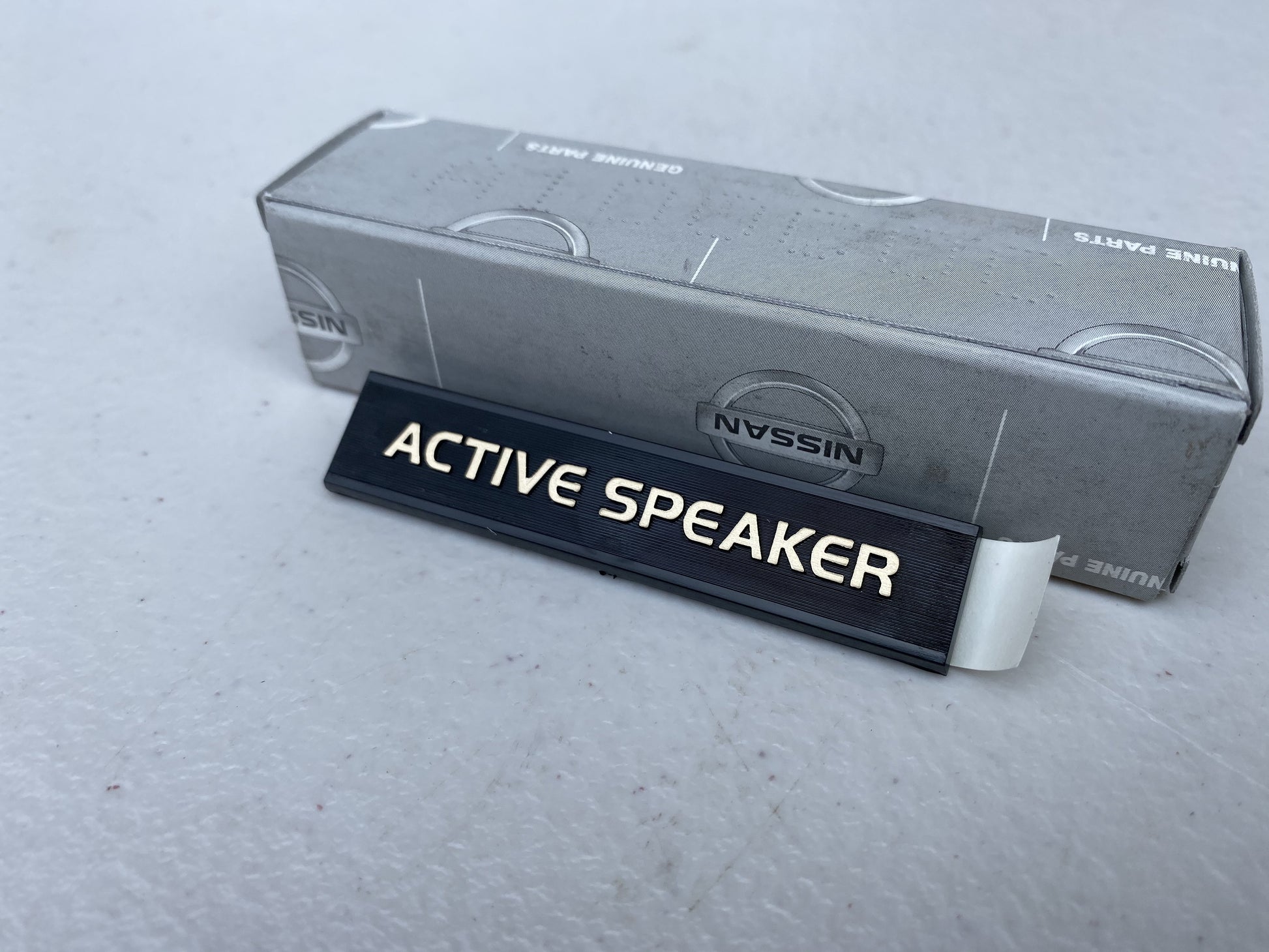 Genuine Nissan 'Active Speaker' Rear Speaker Emblem to suit Nissan Skyline R32 Models / Silvia S13 / 180SX - Vega Autosports
