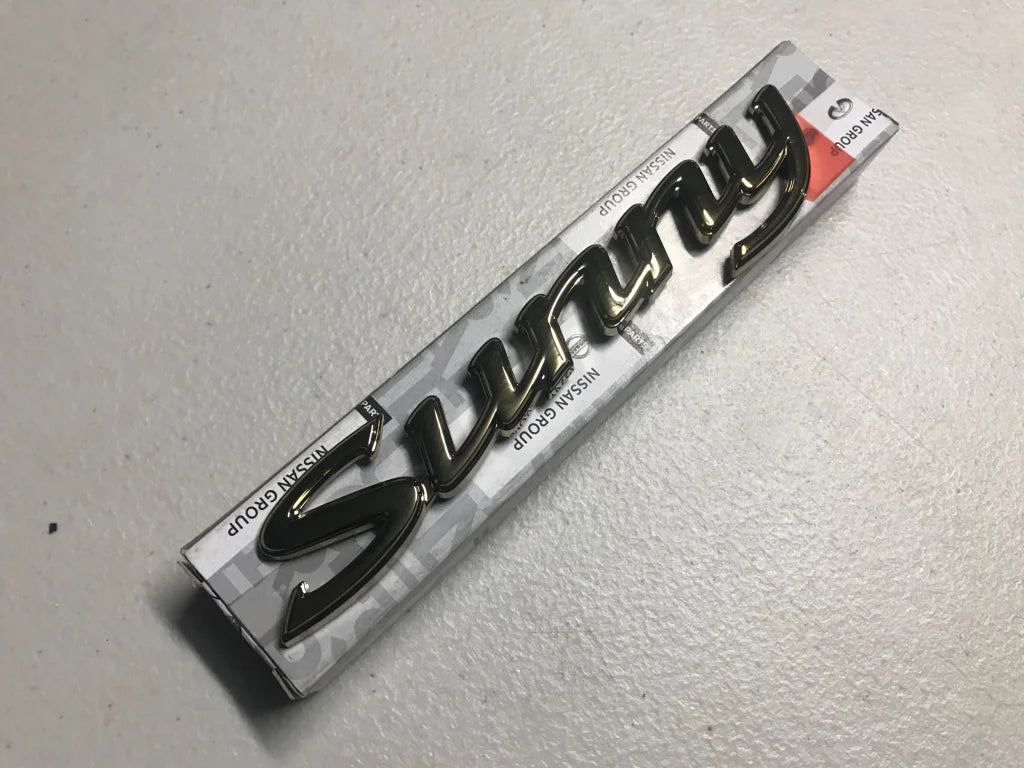 Datsun 1200 Sunny Gold Boot Emblem Badge - Vega Autosports