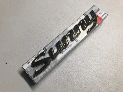 Datsun 1200 Sunny Gold Boot Emblem Badge - Vega Autosports