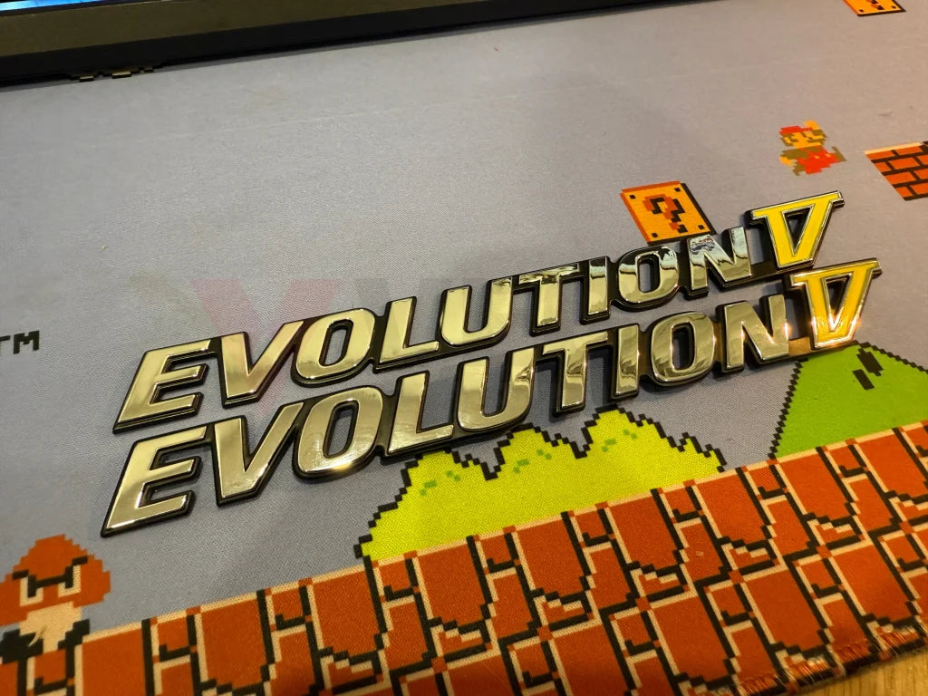 Rear ’Evolution V’ Emblem to suit Mitsubishi Lancer Evolution 5 CP9A MR388458 Emblems Badges and Decals