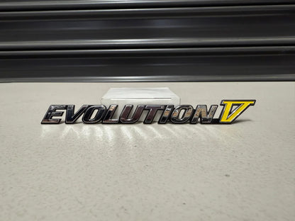 Rear ’Evolution V’ Emblem to suit Mitsubishi Lancer Evolution 5 CP9A MR388458 Emblems Badges and Decals