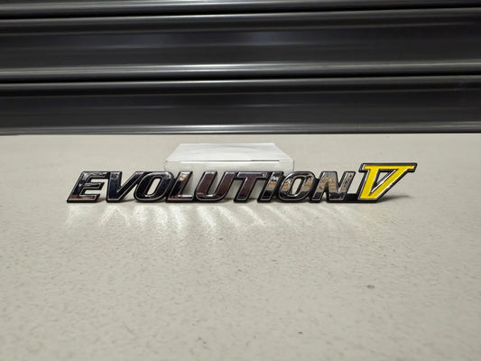 Rear ’Evolution V’ Emblem to suit Mitsubishi Lancer Evolution 5 CP9A MR388458 Emblems Badges and Decals