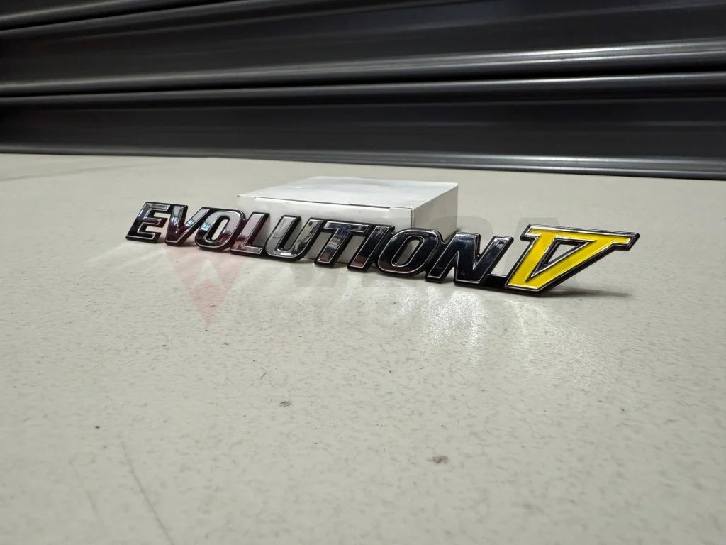 Rear ’Evolution V’ Emblem to suit Mitsubishi Lancer Evolution 5 CP9A MR388458 Emblems Badges and Decals