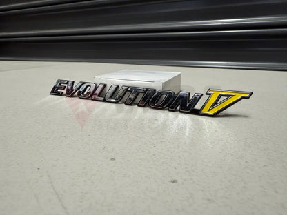Rear ’Evolution V’ Emblem to suit Mitsubishi Lancer Evolution 5 CP9A MR388458 Emblems Badges and Decals
