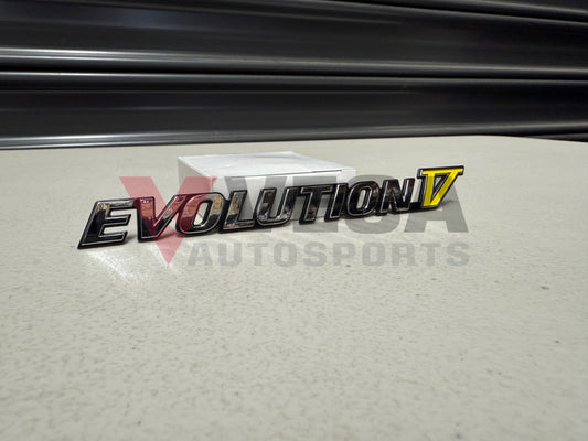 Rear ’Evolution V’ Emblem to suit Mitsubishi Lancer Evolution 5 CP9A MR388458 Emblems Badges and Decals