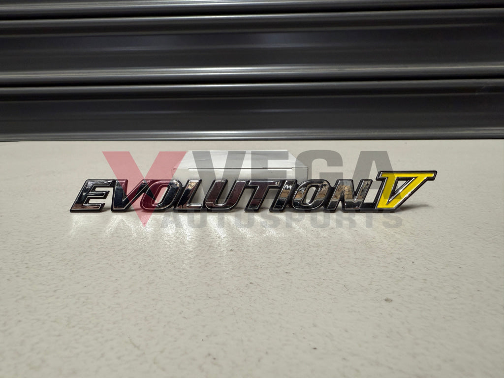 Rear ’Evolution V’ Emblem to suit Mitsubishi Lancer Evolution 5 CP9A MR388458 Emblems Badges and Decals