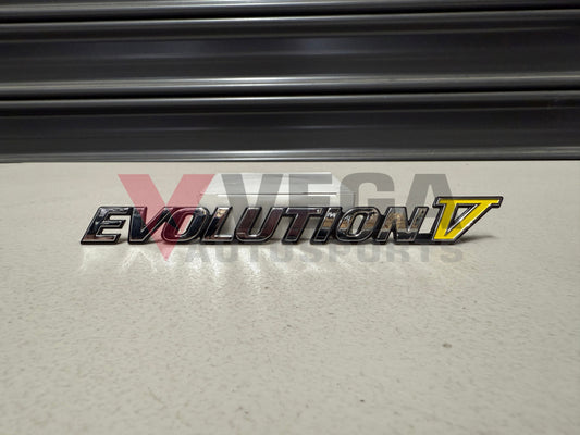 Rear ’Evolution V’ Emblem to suit Mitsubishi Lancer Evolution 5 CP9A MR388458 Emblems Badges and Decals